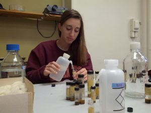 Nina Zegler, an undergraduate researcher in Dr. Marek's lab, refilling a vial with 80% EtOH
